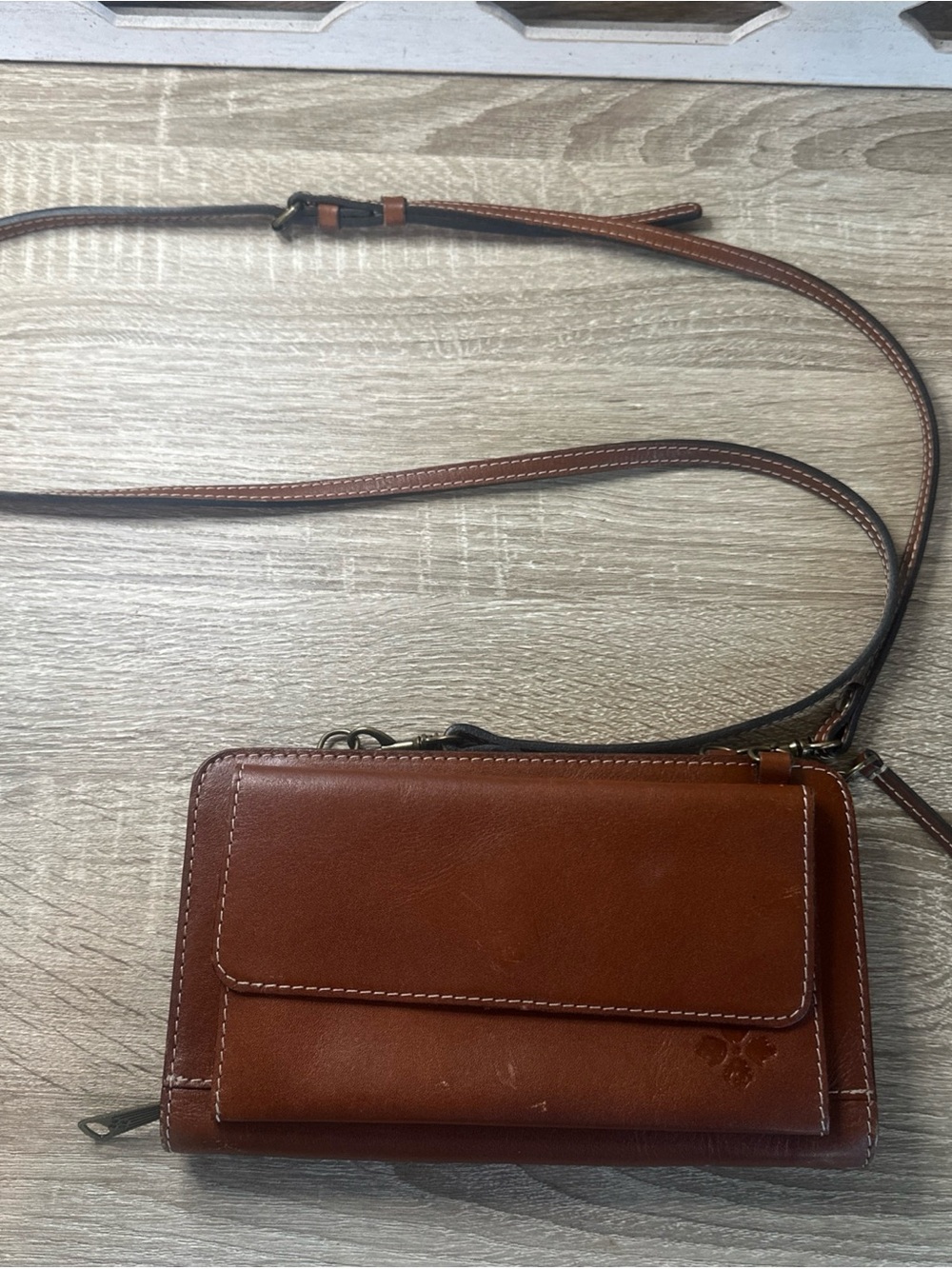 Patricia Nash Crossbody Organizer in tan leather.